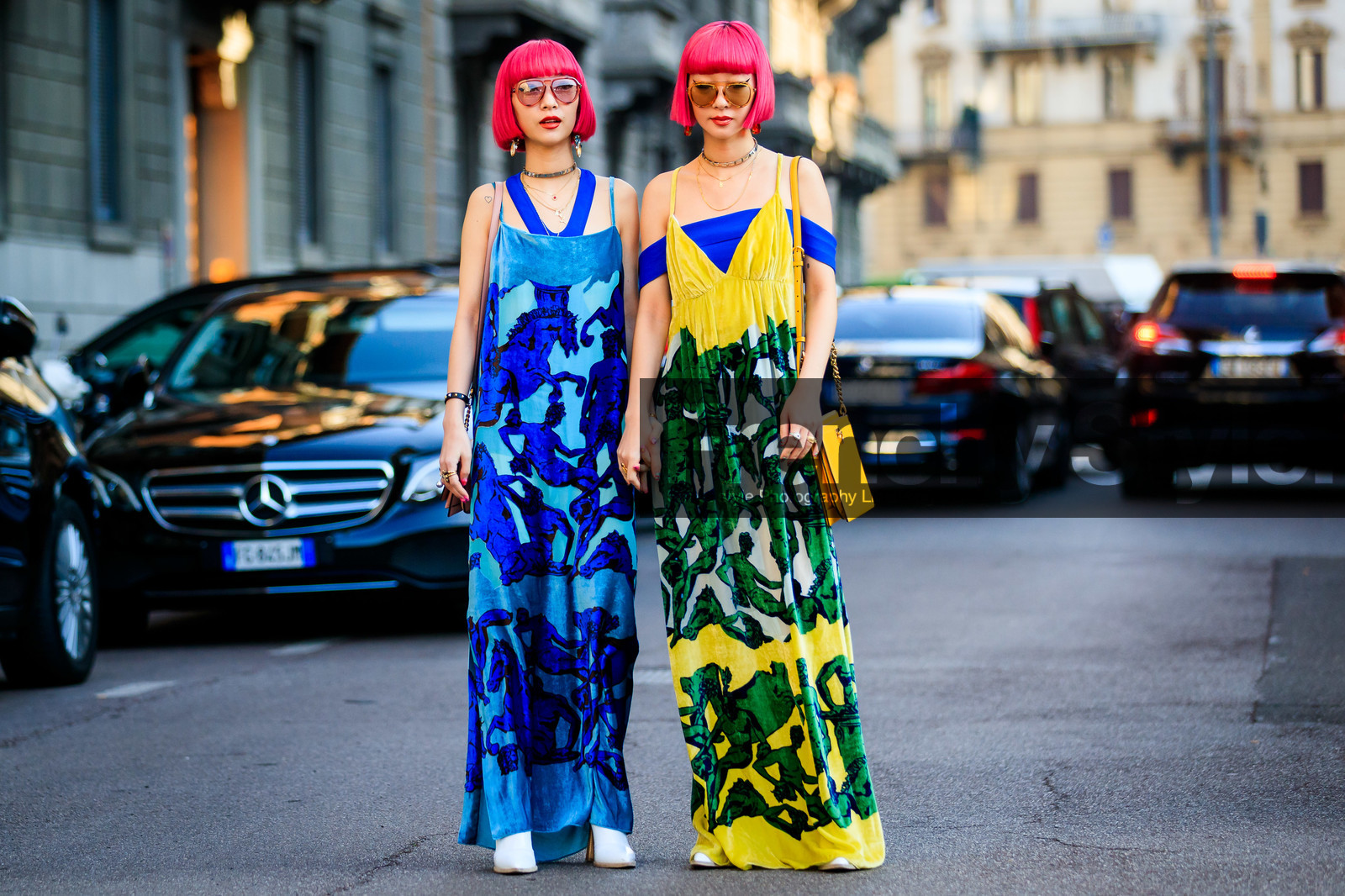 Ami and Aya Suzuki, ferragamo bag, yellow dress, light blue dress, sleeveless dress, half shoulder dress, long dress, animal print dress, printed dress, green dress, bicolor dress, yellow leather bag, shoulder bag, golden strap bag, nude leather bag, pink hair, dyed hair, aviator sunglasses, pink sunglasses, yellow sunglasses, silvered choker, golden earrings, multi necklace, strassed earrings, dangling earrings, low necked dress, fashion week, frenchystyle, FW, jonathan paciullo, street style, MFW, MILAN, AUTUMN WINTER 2020-2021, FALL WINTER 2020-2021, FW 20-21, horizontal, atmosphere details, full length