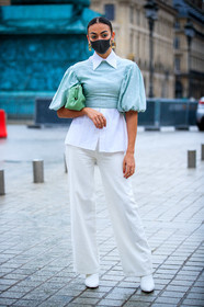 golden earrings, square shape earrings, dangling earrings, green eyeliner, light green blouse, light green leather bag, light green leather clutch, balloon sleeves, white shirt, white pants, white leather boots, flare pants, covid face mask, fashion week, frenchystyle, FW, jonathan paciullo, street style, PFW, PARIS, SPRING SUMMER 2021, SS 21, vertical, full length