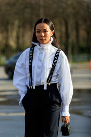 yoyo cao, white shirt, ruffle shirt, high collar shirt, suspenders, chanel suspenders, logo printed suspenders, black suspenders, black pants, black leather bag, lavalliere collar, chanel bag, fashion week, frenchystyle, FW, jonathan paciullo, street style, PFW, PARIS, vertical, atmosphere details, detail