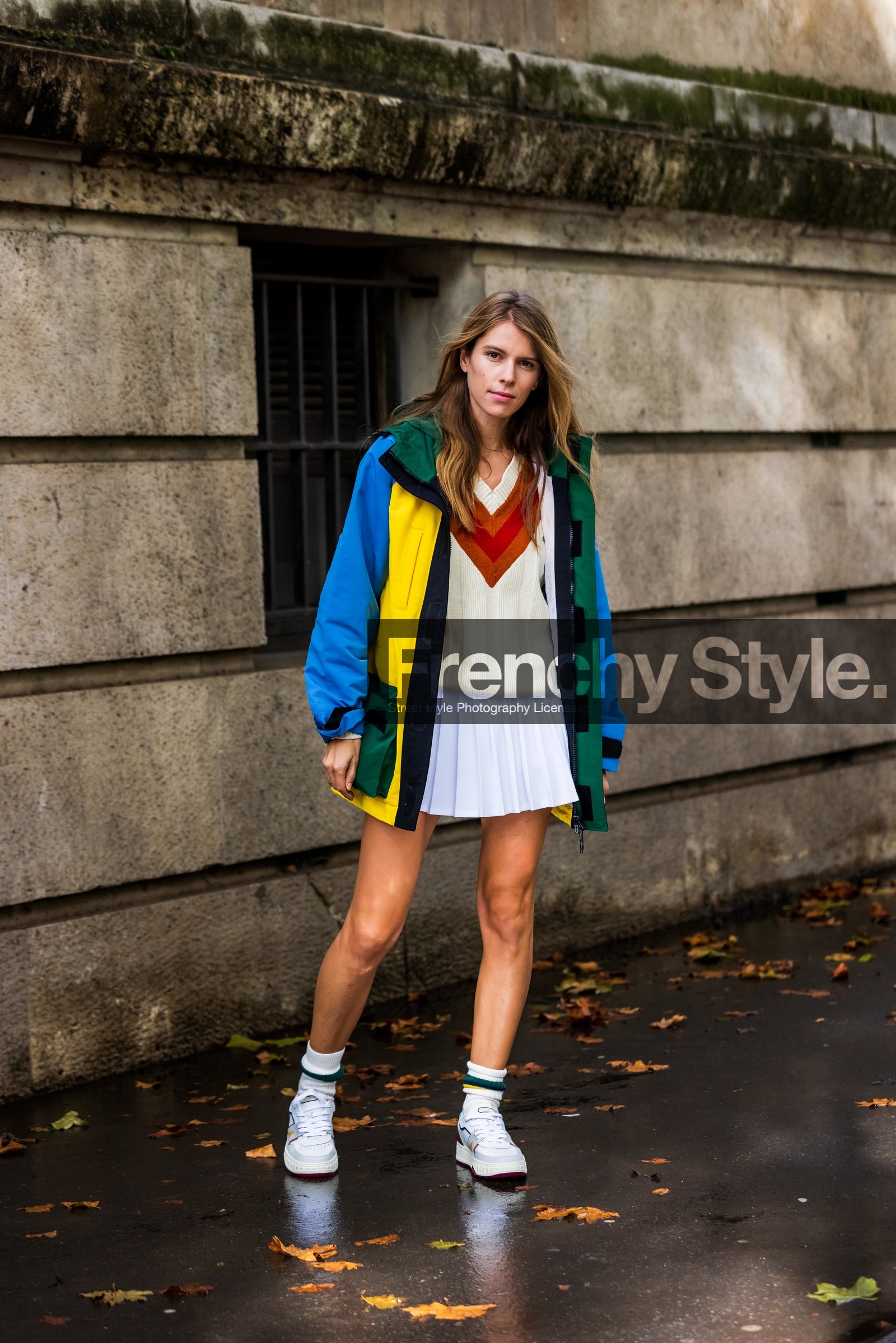 blue jacket, color, jacket, jumper, knitwear, lacoste look, mini skirt, Monica de la Villardière, pleated skirt, skirt, sneakers, socks, tennis look, v neck jumper, white jumper, white skirt, white sneakers, white socks, yellow jacket, lacoste, fashion week, frenchystyle, FW, jonathan paciullo, street style, PFW, PARIS, SPRING SUMMER 2022, SS 22, vertical, full length