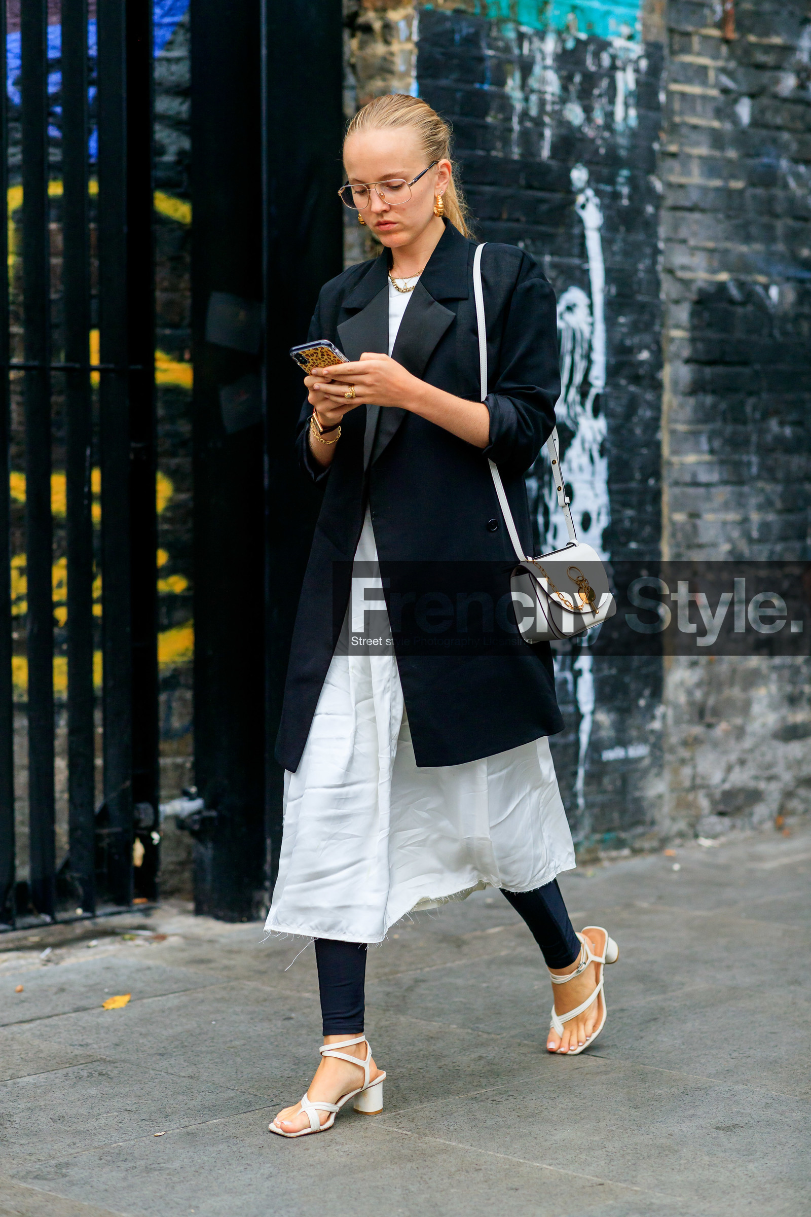 alexandra carl, aviator glasses, black and white look, black jacket, black legging, golden earrings, hoop earrings, long jacket, mid long skirt, multi straps sandals, silk skirt, used skirt, used t-shirt, white sandals, white skirt, white t-shirt, fashion week, frenchystyle, FW, jonathan paciullo, street style, vertical, full length