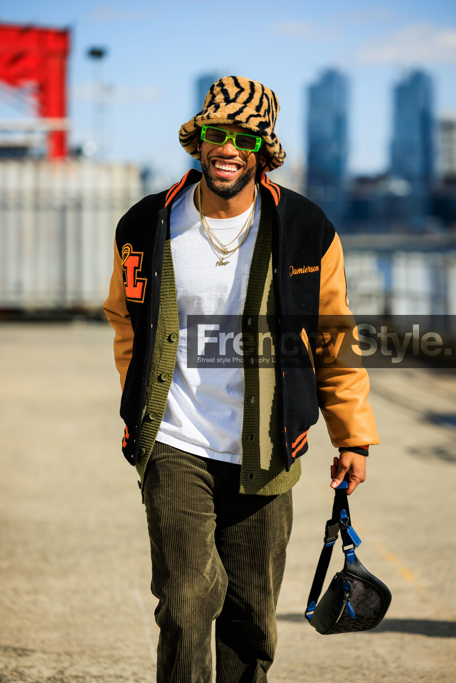 bucket hat, baseball jacket, black jacket, corduroy pants, kaki pants, banana bag, black fanny pack, orange font printed white tshirt, green sunglasses, overlayed necklaces, animal print hat, groovy sunglasses, fashion week, frenchystyle, FW, jonathan paciullo, street style, NYFW, NEW YORK, AUTUMN WINTER 2022-2023, FALL WINTER 2022_2023, FW 22-23, vertical, atmosphere details