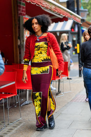 red cardigan, burgundy top, yellow top, floral printed top, burgundy skirt, yellow skirt, floral printed skirt, split skirt, black leather boots, doc marteens shoes, laced boots, chain necklace, silver necklace, shopping bag, knit shopping bag, orange bag, fashion week, frenchystyle, FW, jonathan paciullo, street style, vertical, full length