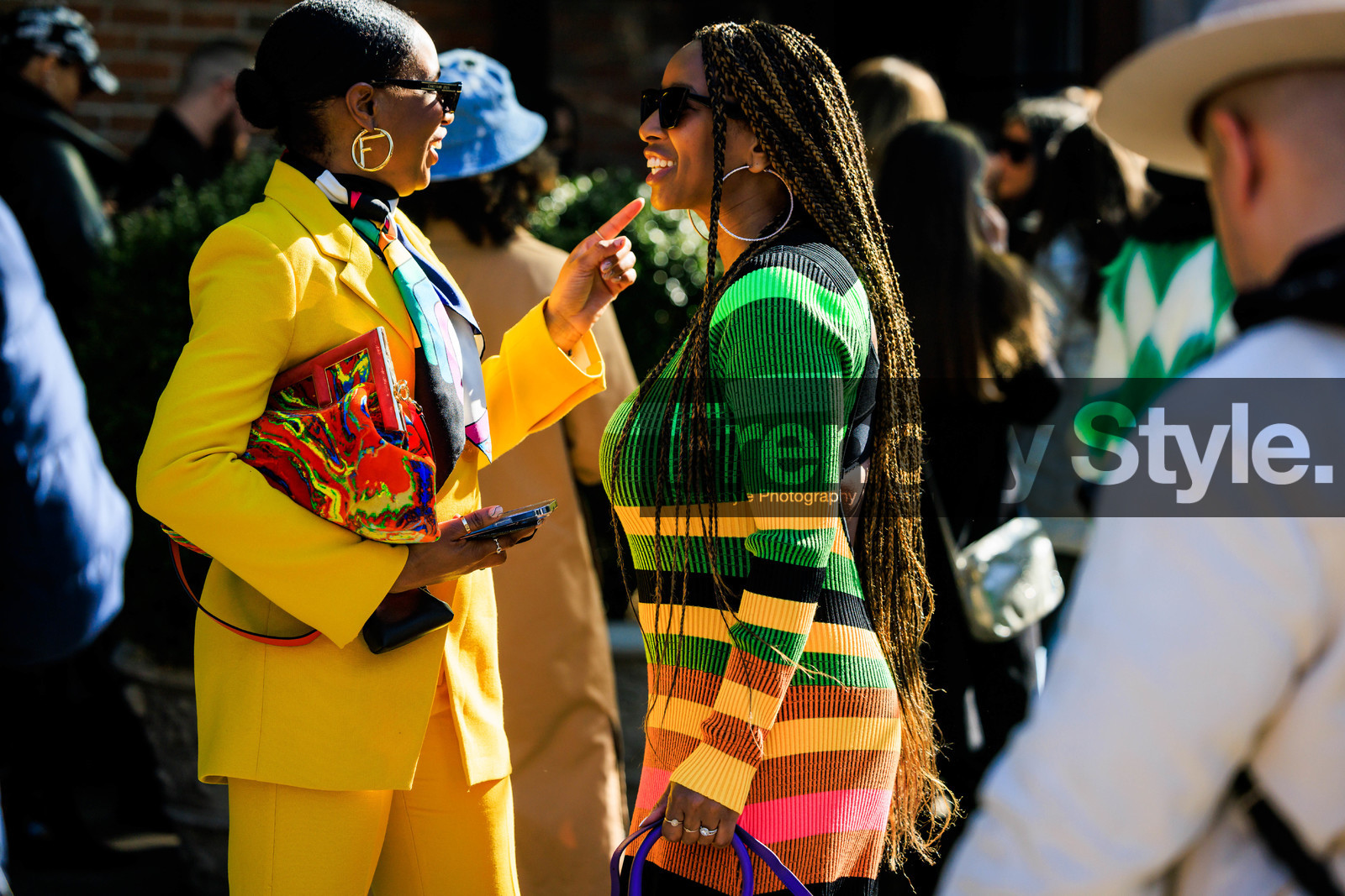 yemm, yellow suit look, multicolor pouch bag, fendi loops earrings, multicolor striped knitted dress, black sun glasses, rings, big loop earrings, long braids, fashion week, frenchystyle, FW, jonathan paciullo, street style, NYFW, NEW YORK, AUTUMN WINTER 2022-2023, FALL WINTER 2022_2023, FW 22-23, atmosphere details, horizontal