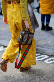 estelle pigault, gucci bag, monogrammed bag, brown leather bag, striped bag, striped strap bag, yellow pants, brocart pants, flare pants, silk pants, floral printed pants, camel suede belt, brown suede belt, striped belt, bicolor belt, belted pants, close up detail, bag detail, legs detail, fashion week, frenchystyle, FW, jonathan paciullo, street style, LFW, LONDON, AUTUMN WINTER 2020-2021, FALL WINTER 2020-2021, FW 20-21, vertical, atmosphere details, detail