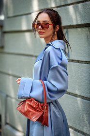 yuzefi bag, red bag, red leather bag, hand bag, mini bag, light blue dress, satin dress, satin belt, belted dress, low necked dress, long sleeves dress, long dress, golden necklace, multi necklace, golden earrings, hoop earrings, shell necklace, brown sunglasses, red sunglasses, futurist shape sunglasses, fashion week, frenchystyle, FW, jonathan paciullo, street style, MFW, MILAN, SPRING SUMMER 2021, SS 21, vertical, detail