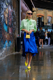 leonie hanne, black sunglasses, square shape glasses, dior sunglasses, light green shirt, lavalliere collar, blue skirt, silk skirt, mid long skirt, jacquemus bag, hand bag, yellow leather bag, mini bag, yellow slippers, sharp end shoes, fashion week, frenchystyle, FW, jonathan paciullo, street style, vertical, full length