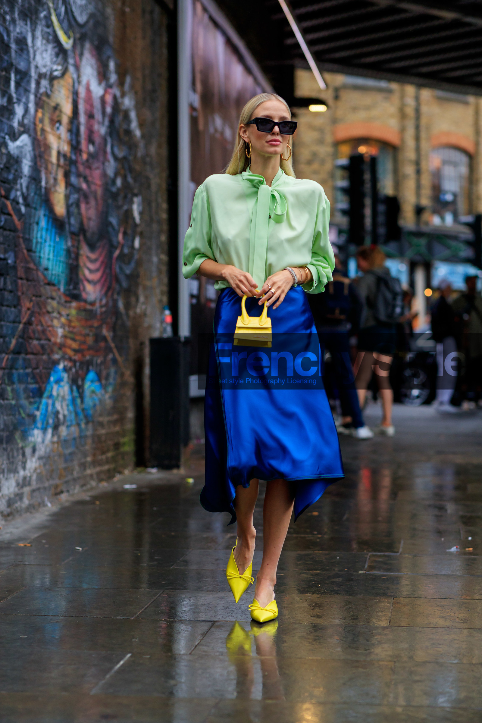 leonie hanne, black sunglasses, square shape glasses, dior sunglasses, light green shirt, lavalliere collar, blue skirt, silk skirt, mid long skirt, jacquemus bag, hand bag, yellow leather bag, mini bag, yellow slippers, sharp end shoes, fashion week, frenchystyle, FW, jonathan paciullo, street style, vertical, full length