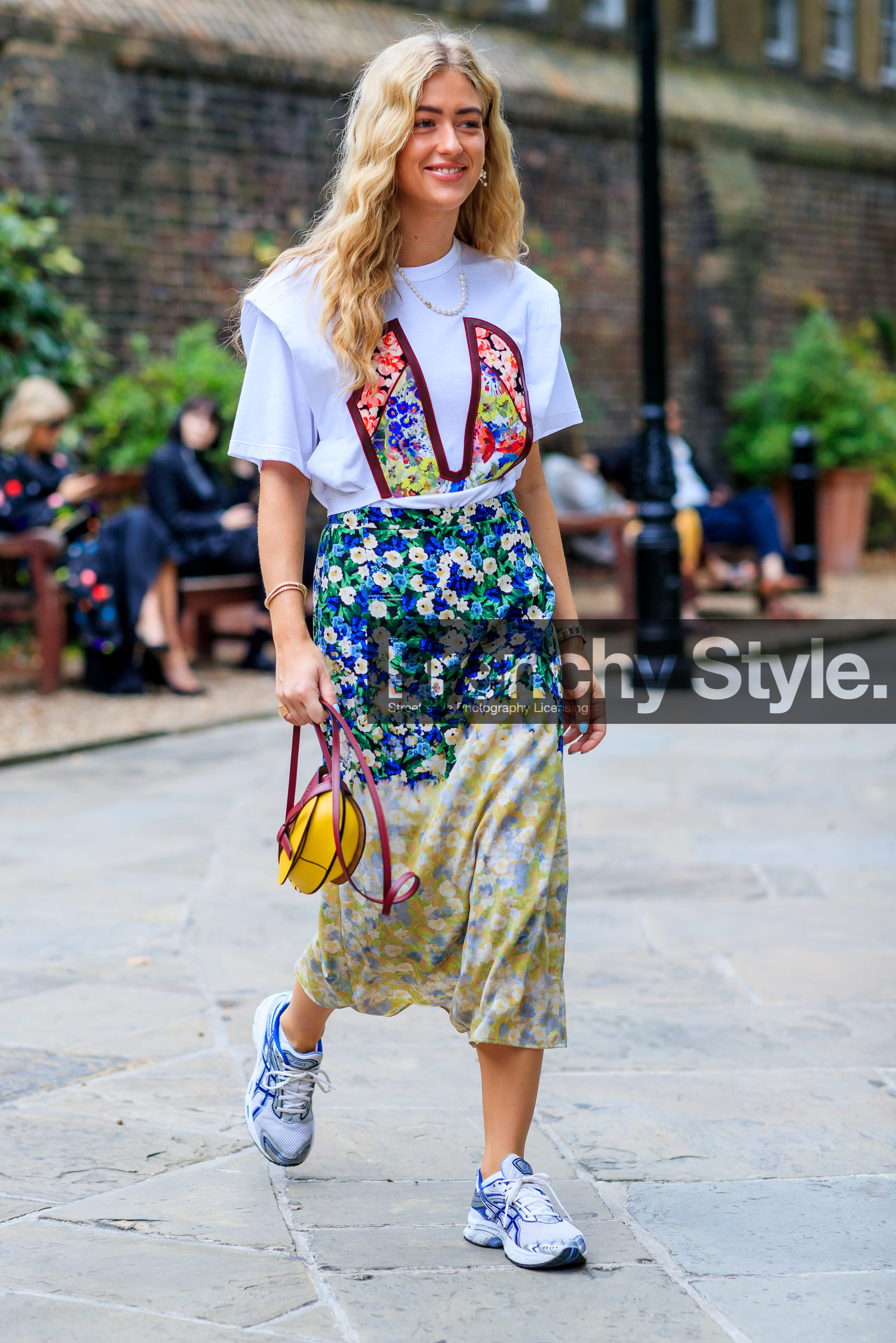 emili sindlev, floral print total look, white t-shirt, short sleeves t-shirt, floral printed skirt, floral printed t-shirt, mid long skirt, silk skirt, rolex watch, silvered and golden watch, silver and golden watch, man style watch, asics sneakers, silvered sneakers, white sneakers, blue sneakers, loewe bag, hand bag, burgundy leather bag, yellow leather bag, light green skirt, blue skirt, tie and dye skirt, pearl earrings, pearl necklace, fashion week, frenchystyle, FW, jonathan paciullo, street style, vertical, full length