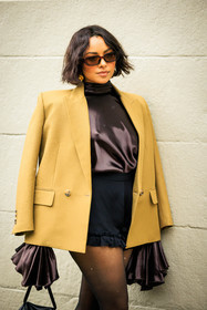 details, close up, short hair, sunglasses, black short, silk shirt, ruffles shirt, brown shirt, camel blazer, golden earrings, Kat Graham, fashion week, frenchystyle, FW, jonathan paciullo, street style, NYFW, NEW YORK, AUTUMN WINTER 2022-2023, FALL WINTER 2022_2023, FW 22-23, vertical, atmosphere details