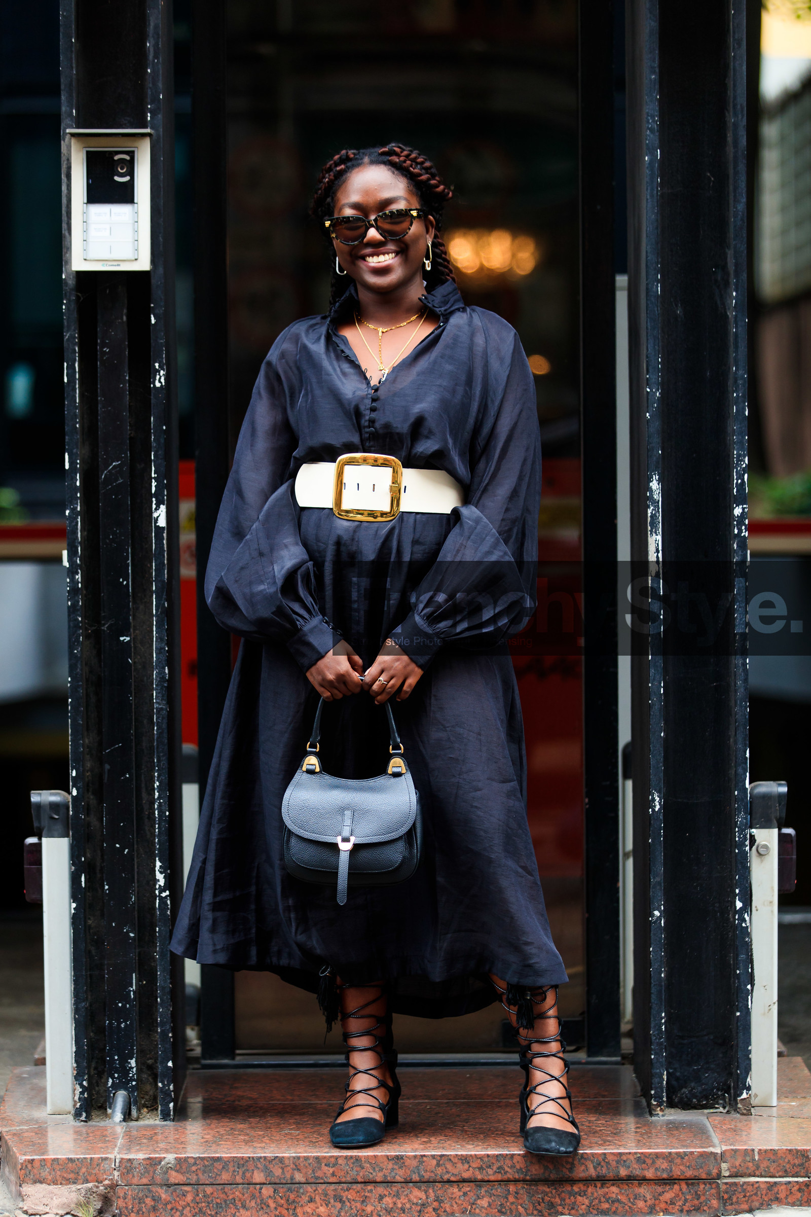 black dress, long sleeves dress, scale sunglasses, bottega veneta sunglasses, butterfly sunglasses, golden earrings, diamond earrings, round shape earrings, dress shirt, button dress, belted dress, white leather belt, golden buckle belt, black shoes, suede shoes, laced shoes, black leather bag, hand bag, lois opoku, street style, jonathan paciullo, FW, frenchystyle, fashion week, MFW, MILAN, SPRING SUMMER 2021, SS 21, vertical, full length