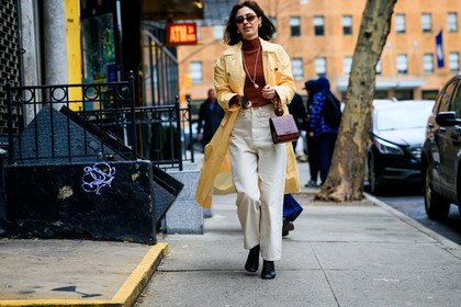 black shoes, brown bag, brown sweater, denim pants, jeans, leather bag, leather shoes, necklace, sunglasses, trousers, white denim, yellow coat, frenchystyle, jonathan paciullo, street style, NYFW, NEW YORK, AUTUMN WINTER 2019-2020, AW 19-20, FALL WINTER 2019-2020, FW 19-20, fashion week, FW, atmosphere details, horizontal, full length