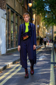 model, white eyeliner, neon top, navy blue jacket, striped jacket, long jacket, navy blue pants, cropped pants, striped pants, doc marteens shoes, laced shoes, waist bag, oversize pants, burgundy shoes, navy suits, fire printed bag, fashion week, frenchystyle, FW, jonathan paciullo, street style, vertical, full length