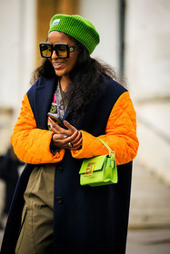 ganni beanie, green beanie, orange sleeves, black winter coat, kaki pants, baggy trousers, black belt, green handbag, black sunglasses, ganni cardigan, ganni cardigan, multicolor cardigan, green top, fashion week, frenchystyle, FW, jonathan paciullo, street style, AUTUMN WINTER 2022-2023, FALL WINTER 2022_2023, FW 22-23, PFW, PARIS, vertical, detail, dual toned jakcet