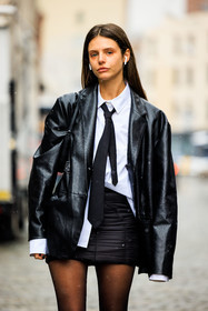 airpods, black tie, school girl style, minimal look, white shirt, close up, details, black jacket, leather jacket, mini skirt, black skirt, black tights, Alizée Gamberini, fashion week, frenchystyle, FW, jonathan paciullo, street style, NYFW, NEW YORK, AUTUMN WINTER 2022-2023, FALL WINTER 2022_2023, FW 22-23, vertical, atmosphere details