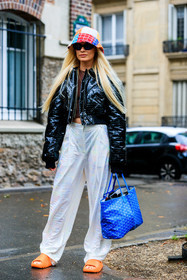 blue bag, blue leather bag, hand bag, logo all over, logo printed bag, goyard bag, orange sandals, orange shoes, orange slippers, orange flip flop, yeezy slide, yeezy shoes, multicolor hat, knit hat, black leather jacket, black jacket, leather jacket, snake skin jacket, animal skin jacket, animal skin pants, snake skin pants, white pants, loose pants, oversize pants, cropped jacket, Thora Valdimars, fashion week, frenchystyle, FW, jonathan paciullo, street style, PFW, PARIS, AUTUMN WINTER 2021-2022, FALL WINTER 2021-2022, FW 21-22, vertical, full length