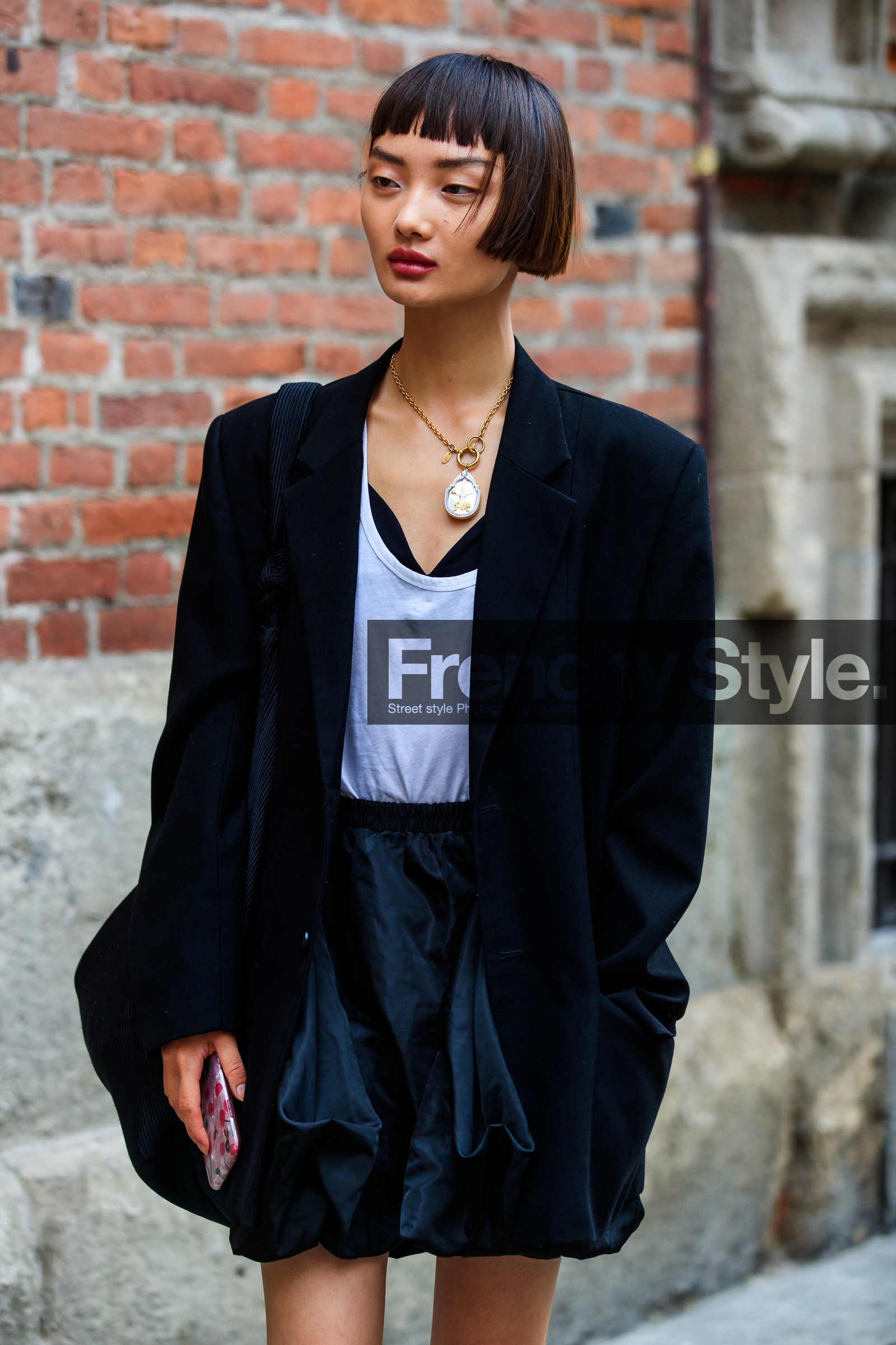 black jacket, black skirt, black bag, shoulder bag, pleated bag, big bag, ruffle skirt, big chain necklace, golden necklace, silvered earrings, white top, street style, jonathan paciullo, FW, frenchystyle, fashion week, MFW, MILAN, SPRING SUMMER 2021, SS 21, vertical, detail, model