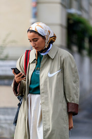 nike shoes, nike jacket, light beige trench coat, hair scarf, white scarf, silk scarf, floral printed scarf, chanel earrings, green sweatshirt, PARIS, PFW, SPRING SUMMER 2020, SS 20, fashion week, frenchystyle, FW, jonathan paciullo, street style, vertical, atmosphere details, detail