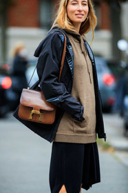 alexandra golovanoff, black parka, black skirt, black socks, brown pullover, brown hoodie, camel hoodie, camel pullover, knit hoodie, knit skirt, knitwear, mid long skirt, brown leather bag, shoulder bag, hermes bag, constance hermes bag, street style, jonathan paciullo, FW, frenchystyle, fashion week, PFW, PARIS, SPRING SUMMER 2021, SS 21, vertical, atmosphere details, detail