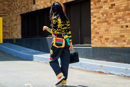 atmosphere details, black bag, converse, cropped top, denim pants, fashion week, frenchystyle, full length, FW, graphic sweater, horizontal, jeans, jonathan paciullo, leather bag, multicolor pants, NEW YORK, NYFW, patchwork, ponytail, prada, printed sweater, SPRING SUMMER 2018, SS 18, street style, trousers, white sneakers, yellow pants, yellow sweater, zebra
