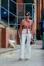 deborah reyner sebag, leather shirt, brown leather shirt, lavalliere collar, white leather pants, high waist pants, belted pants, flare pants, square shape glasses, celine sunglasses, hand bag, animal printed bag, bottega veneta shoes, white leather shoes, squared toed shoes, chain detail shoes, fur bag, fashion week, frenchystyle, FW, jonathan paciullo, street style, vertical, full length