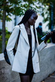 black backpack, black bag, black crop top, black denim, black shirt, black top, blazer, braid, crop top, denim skirt, leather backpack, leather bag, mini skirt, ribbed top, skirt, smartphone, top, white blazer, fashion week, frenchystyle, FW, jonathan paciullo, street style, PFW, PARIS, SPRING SUMMER 2022, SS 22, vertical, atmosphere details, model