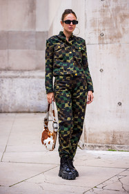 black sunglasses; camouflage print; check; jacket; khaki jacket; khaki pants; pants; printed jacket; printed pants; rectangle sunglasses; sunglasses: boots; black boots; bag; animal print; white bag; brown bag
