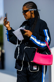 bag, black sunglasses, fluo pink bag, gold earring, gold ring, jogging, leather bag, lines, logo, mask sunglasses, navy jacket, navy pants, nike jacket, nike jogging, ring, smartphone, sport, sport jacket, sunglasses, zipped jacket, street style, jonathan paciullo, FW, frenchystyle, fashion week, PFW, PARIS, SPRING SUMMER 2022, SS 22, vertical, atmosphere details