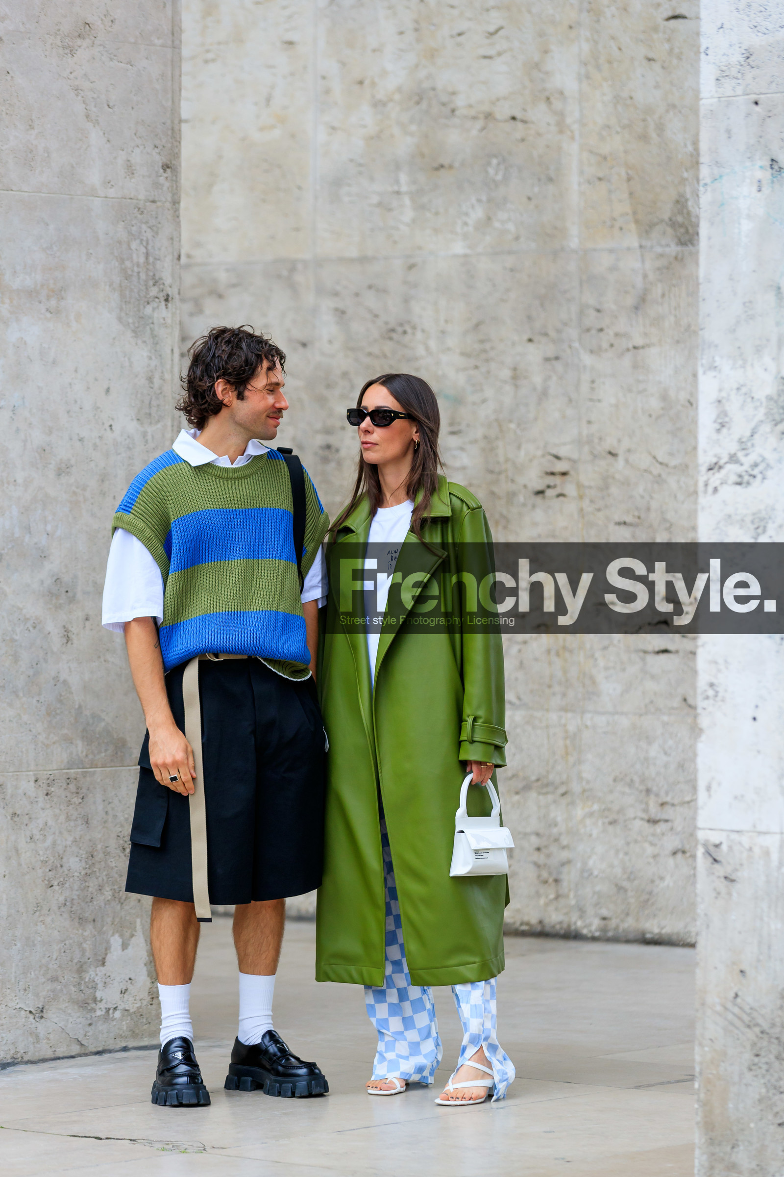 green leather coat, white t-shirt, white leather bag, mini bag, hand bag, letter printed bag, long coat, oversize coat, oversize t-shirt, checked pants, white pants, light blue pants, flare pants, silk pants, blue pants, bicolor pants, alice barbier, striped pullover, oversize pullover, green pullover, blue pullover, short sleeves pullover, sleeveless pullover, white polo shirt, black bermuda shorts, loose shorts, white socks, black leather loafers, prada shoes, prada loafers, JS roques, fashion week, frenchystyle, FW, jonathan paciullo, street style, PFW, PARIS, SPRING SUMMER 2022, SS 22, vertical, full length