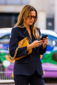 aviator sunglasses, bag, blazer, chain gold, navy blazer, ochre bag, orange bag, smartphone, stripes, stripes blazer, sunglasses, tortoise sunglasses, fashion week, frenchystyle, FW, jonathan paciullo, street style, PFW, PARIS, SPRING SUMMER 2022, SS 22, vertical, atmosphere details