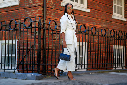 chrissy rutherford, aviator sunglasses, multi necklace, charms necklace, white jumpsuit, wandler bag, black leather bag, hand bag, high heels sandals, sheer strap sandals, fashion week, frenchystyle, FW, jonathan paciullo, street style, atmosphere details, horizontal, full length