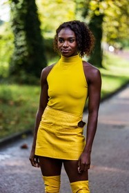 color, courreges bag, courreges look, Dina Asher Smith, leather bag, leather skirt, mini skirt, skirt, top, turtleneck, yellow skirt, yellow top, yellow turtleneck, street style, jonathan paciullo, FW, frenchystyle, fashion week, PFW, PARIS, SPRING SUMMER 2022, SS 22, vertical, atmosphere details