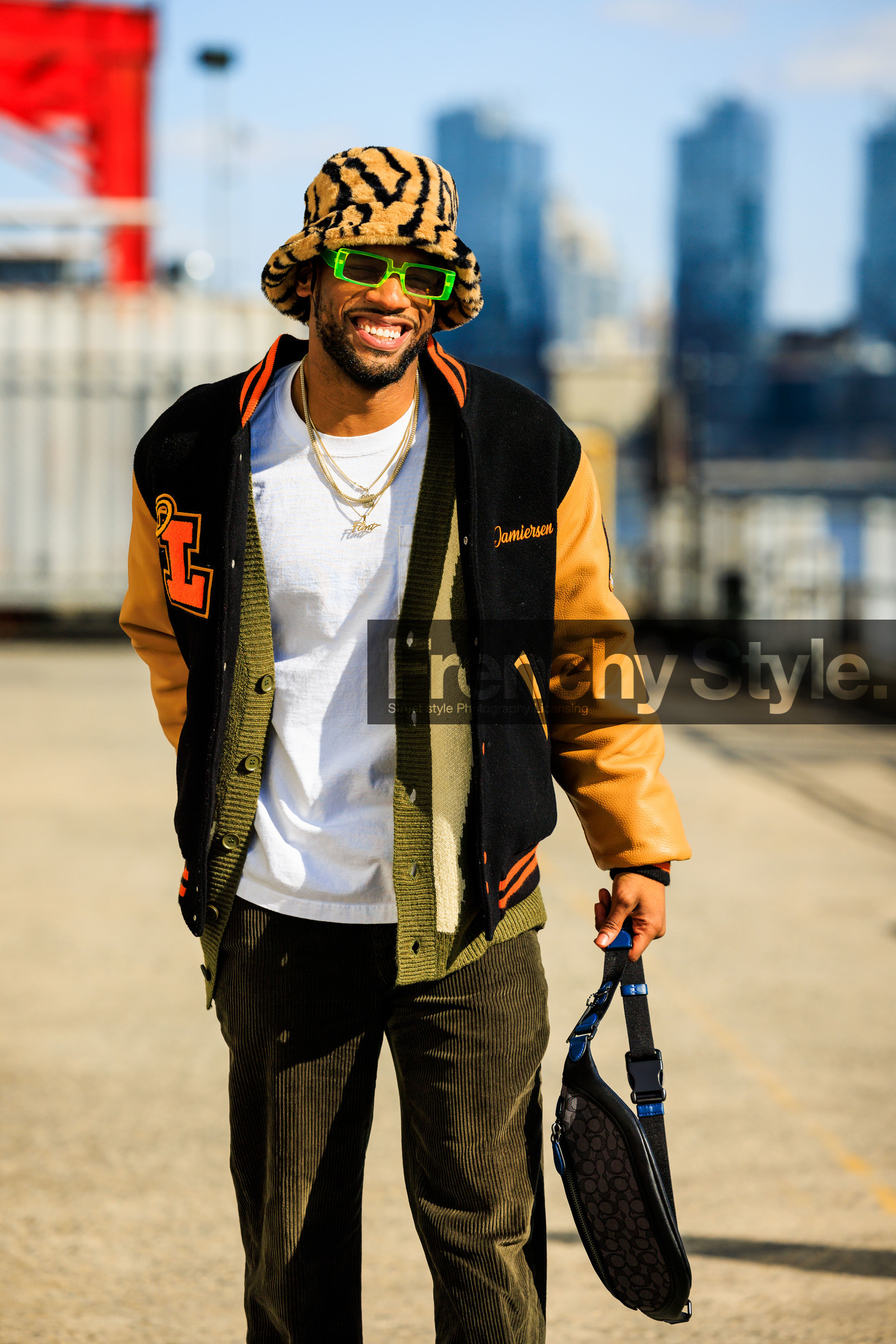 bucket hat, baseball jacket, black jacket, corduroy pants, kaki pants, banana bag, black fanny pack, orange font printed white tshirt, green sunglasses, overlayed necklaces, animal print hat, groovy sunglasses, fashion week, frenchystyle, FW, jonathan paciullo, street style, NYFW, NEW YORK, AUTUMN WINTER 2022-2023, FALL WINTER 2022_2023, FW 22-23, vertical, atmosphere details
