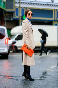 julia restoin roitfeld, erika boldrin, light beige jacket, light beige skirt, orange leather clutch, hermes clutch, bottega veneta sunglasses, metalic frame sunglasses, aviator sunglasses, geometric shape glasses, blue pullover, turtleneck pullover, mid long skirt, split skirt, black tights, black suede shoes, pump, fashion week, frenchystyle, FW, jonathan paciullo, street style, PFW, PARIS, vertical, full length