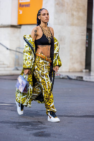 bag, belt, black bra, bra, camel belt, coat, freckles, gold necklace, Hera Pradel, leather belt, long coat, long puffer, necklace, nike sneakers, print, printed coat, printed pants, printed puffer, puffer, sneakers, statement necklace, tattoo, transparent bag, white sneakers, yellow coat, yellow pants, fashion week, frenchystyle, FW, jonathan paciullo, street style, PFW, PARIS, SPRING SUMMER 2022, SS 22, vertical, full length