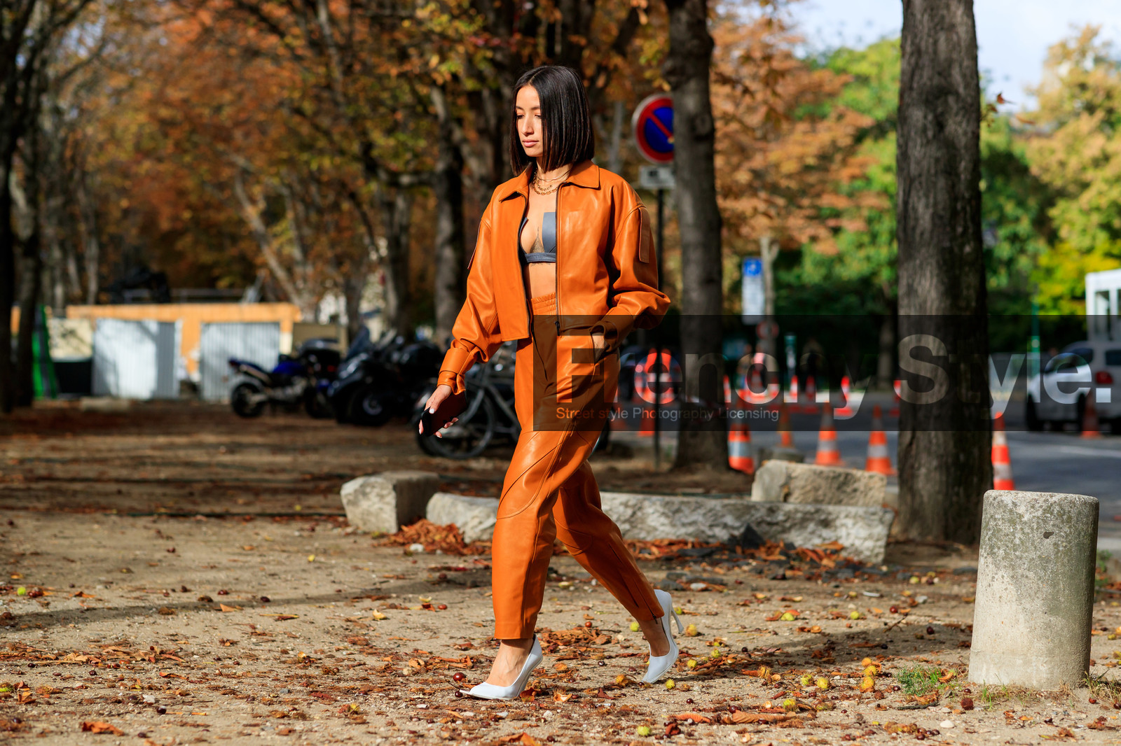 alexandra guerain, orange leather jacket, orange leather pants, orange total look, zipped jacket, black bra, cropped top, low necked top, black leather top, multi necklace, chain necklace, letters necklace, golden necklace, white leather shoes, acne studios shoes, PARIS, PFW, SPRING SUMMER 2020, SS 20, fashion week, frenchystyle, FW, jonathan paciullo, street style, horizontal, atmosphere details, full length