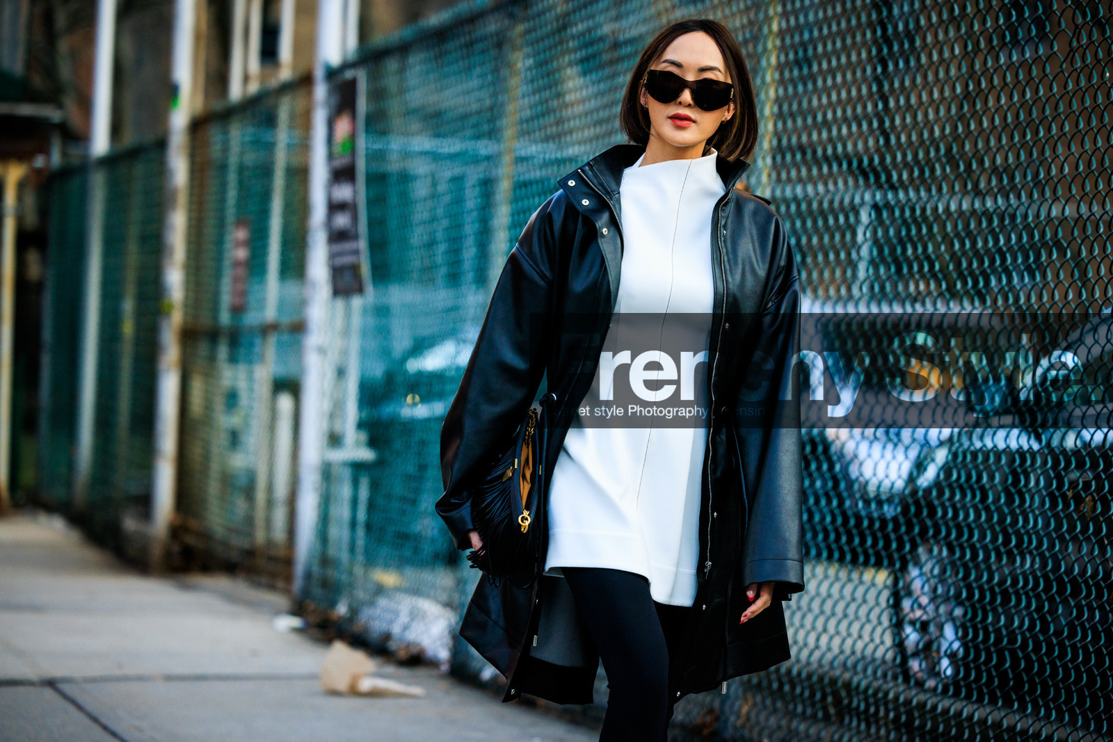 black rain coat, white mini dress, black leggins, black sun glasses, black pouch, Chriselle Lim, fashion week, frenchystyle, FW, jonathan paciullo, street style, NYFW, NEW YORK, AUTUMN WINTER 2022-2023, FALL WINTER 2022_2023, FW 22-23, atmosphere details, horizontal