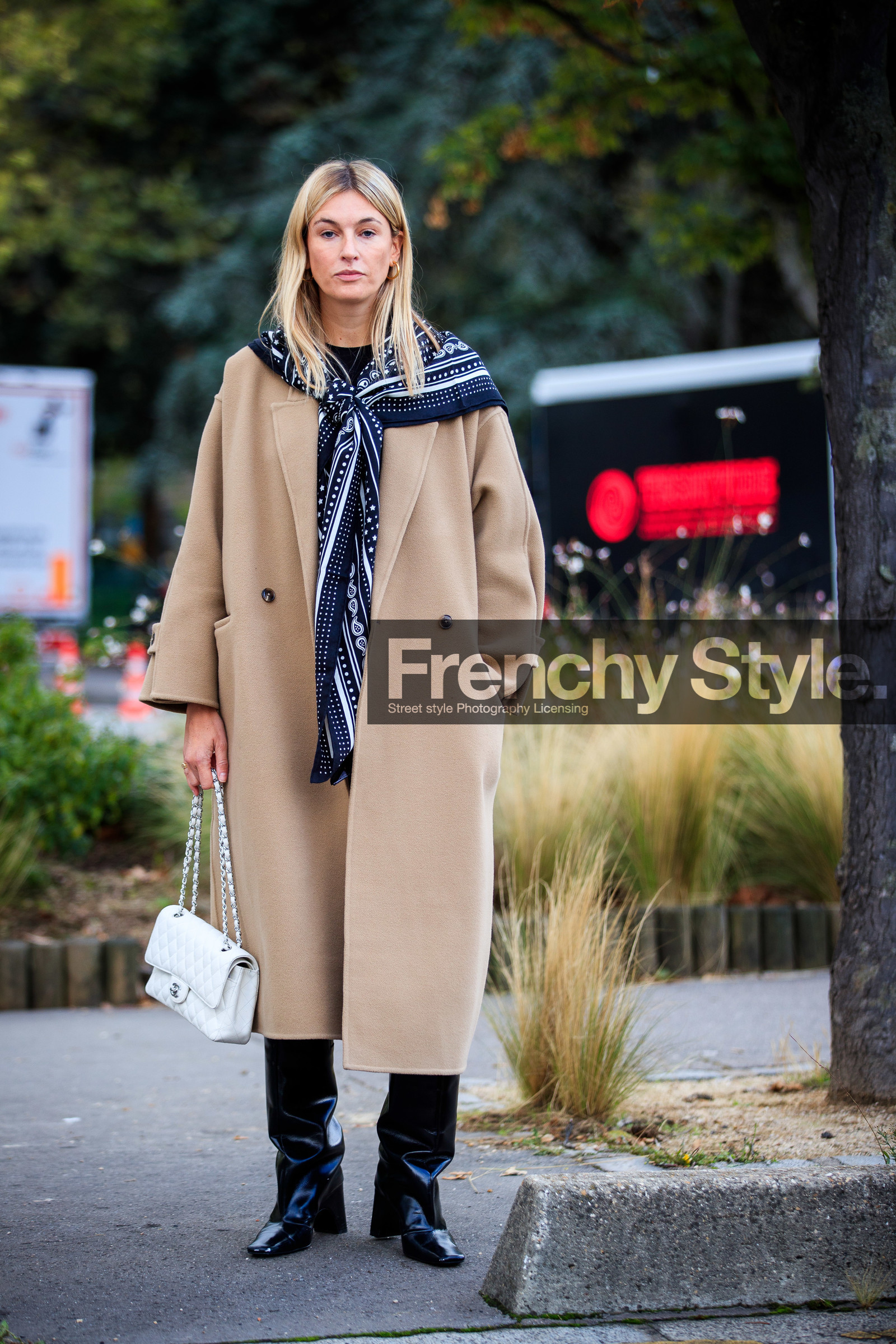 camille charriere, beige coat, white pants, high waist pants, high boots, black scarf, black polish boots, bandana, bandana scarf, hermes scarf, white leather bag, quilted bag, chanel bag, black leather boots, PARIS, PFW, fashion week, frenchystyle, FW, jonathan paciullo, street style, SPRING SUMMER 2021, SS 21, vertical, full length