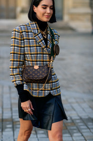 brittany xavier, checked jacket, plaid jacket, yellow jacket, black jacket, white jacket, black skirt, satin skirt, mini skirt, louis vuitton bag, louis vuitton jacket, louis vuitton skirt, louis vuitton necklace, golden necklace, multi necklace, chain necklace, brown leather bag, monogrammed bag, crossbody bag, round shape bag, mini bag, logo strap bag, black leather skirt, PARIS, PFW, SPRING SUMMER 2020, SS 20, fashion week, frenchystyle, FW, jonathan paciullo, street style, vertical, atmosphere details, detail