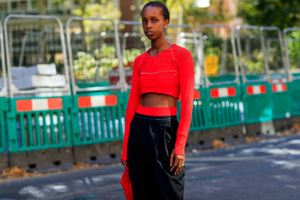 model, cropped top, red top, long sleeves top, asics top, lycra top, prada pants, black bermuda shorts, golden earrings, sportswear, fashion week, frenchystyle, FW, jonathan paciullo, street style, atmosphere details, horizontal, detail