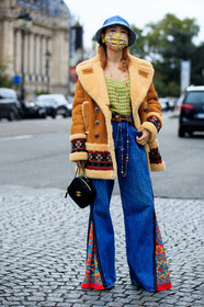 fiona kim, camel suede coat, camel coat, suede coat, fur coat, ethnic printed coat, ethnic printed jeans, flare jeans, patchwork coat, patchwork jeans, light green pullover, openwork pullover, long necklace, golden necklace, stone necklace, black leather bag, box bag, zipped bag, square shape bag, quilted bag, denim, denim hat, marine serre hat, monogrammed hat, floral printed jeans, chanel bag, chanel necklace, blue hat, PARIS, PFW, fashion week, frenchystyle, FW, jonathan paciullo, street style, SPRING SUMMER 2021, SS 21, vertical, full length