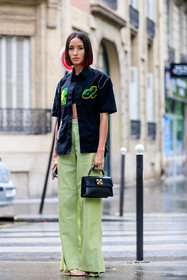 black shirt, black top, black leather bag, black bag, short sleeves shirt, embroidered shirt, green shirt, green pants, light green pants, cropped top, hand bag, off white bag, off white shirt, flare pants, leather pants, alexandra guerain, fashion week, frenchystyle, FW, jonathan paciullo, street style, PFW, PARIS, AUTUMN WINTER 2021-2022, FALL WINTER 2021-2022, FW 21-22, vertical, full length