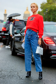 olga karput, red pullover, chanel pullover, blue jeans, denim, flare jeans, white leather bag, hand bag, black leather boots, monogrammed boots, PARIS, PFW, SPRING SUMMER 2020, SS 20, fashion week, frenchystyle, FW, jonathan paciullo, street style, vertical, full length