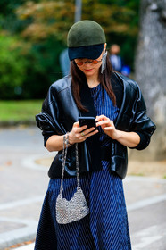 kaki cap, black cap, bicolor cap, black leather jacket, navy blue dress, striped dress, long dress, silvered bag, metal bag, metalic bag, paco rabanne bag, floral printed dress, red sunglasses, round shape sunglasses, julia comil, street style, jonathan paciullo, FW, frenchystyle, fashion week, MFW, MILAN, SPRING SUMMER 2021, SS 21, vertical, detail