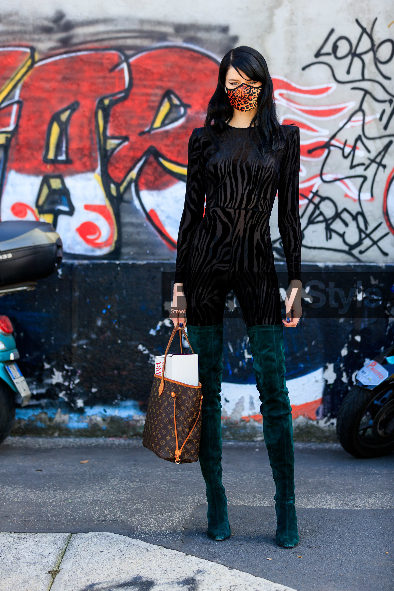 black jumpsuit, velvet jumpsuits, zebra printed jumsuit, long sleeves jumpsuit, tight jumpsuit, tight boots, suede boots, high boots, green boots, green suede boots, monogrammed bag, brown leather bag, louis vuitton bag, hand bag, shopping bag, animal print, leopard print, covid face mask, hannah elyse, street style, jonathan paciullo, FW, frenchystyle, fashion week, MFW, MILAN, SPRING SUMMER 2021, SS 21, vertical, full length, model