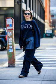 patou black sweatshirt, black cat eye sunglasses, silver pleated skirt, school girl skirt, oversiwed black pants, black and white sneakers, Allegra shaw, fashion week, frenchystyle, FW, jonathan paciullo, street style, NYFW, NEW YORK, AUTUMN WINTER 2022-2023, FALL WINTER 2022_2023, FW 22-23, vertical, full length