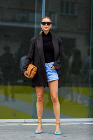 pernille teisbaek, celine sunglasses, black sunglasses, futurist shape sunglasses, black top, turtleneck top, zipped top, denim shorts, mini shorts, light blue denim shorts, striped jacket, dark grey jacket, oversize jacket, plaited bag, camel leather bag, bottega veneta bag, bottega veneta shoes, blue leather sandals, squared toed shoes, fashion week, frenchystyle, FW, jonathan paciullo, street style, MFW, MILAN, SPRING SUMMER 2020, SS 20