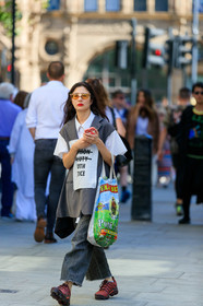 yellow sunglasses, futurist shape sunglasses, white shirt, short sleeves shirt, used shirt, dark grey jacket, sleeveless jacket, used jacket, long jacket, grey jeans, loose jeans, cropped jeans, used jeans, red sneakers, nike shoes, air max sneakers, shopping bag, fashion week, frenchystyle, FW, jonathan paciullo, street style, vertical, full length
