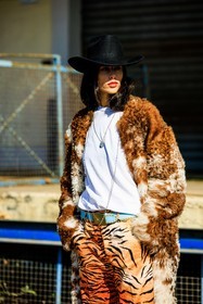 animall, print pants, tiger pants, cowboy hat: white tshirt, furry coat, brown coat, printed pants, buckle belt, blue belt, necklaces, gilda ambrosio, fashion week, frenchystyle, FW, jonathan paciullo, street style, vertical, atmosphere details, detail