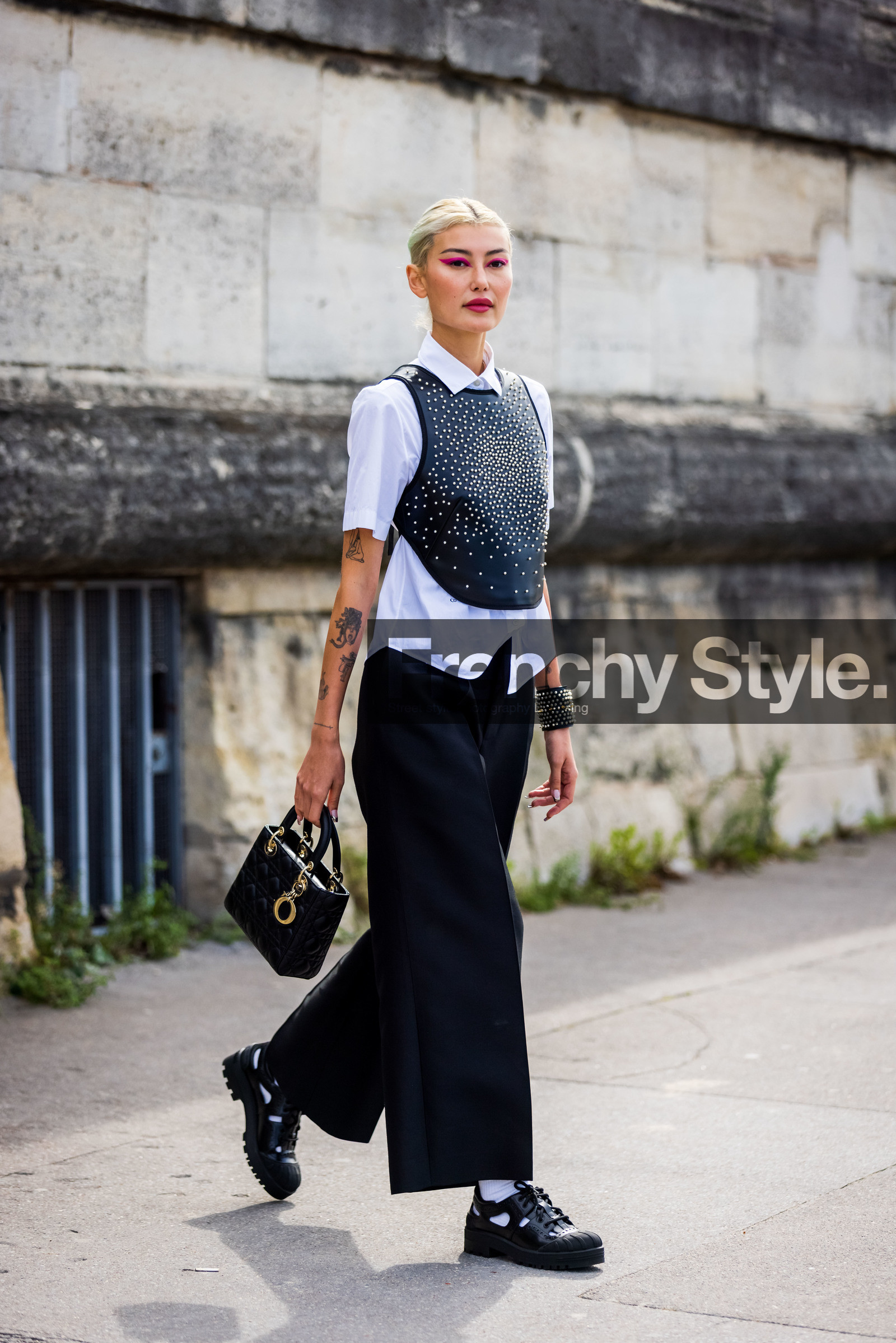 Amalie Gassmann, bag, black bag, black bracelet, black cuff, black derbies, black pants, derbies, dior bag, dior look, flare pants, large pants, leather bag, leather bracelet, leather derbies, leather top, pearl top, pink eyeliner, pleated pants, quilted bag, shirt, tattoo, white shirt, white sock, street style, jonathan paciullo, FW, frenchystyle, fashion week, PFW, PARIS, SPRING SUMMER 2022, SS 22, vertical, full length